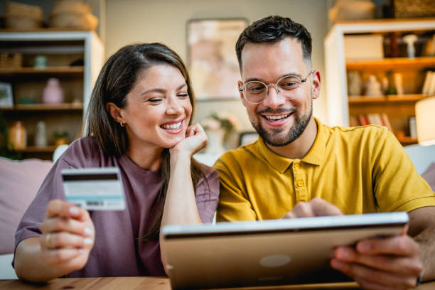 istock Young couple using tablet for online shopping 2169199094