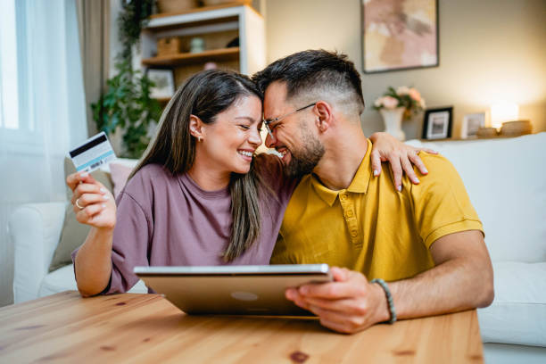 istock Young couple using tablet for online shopping 2169199129