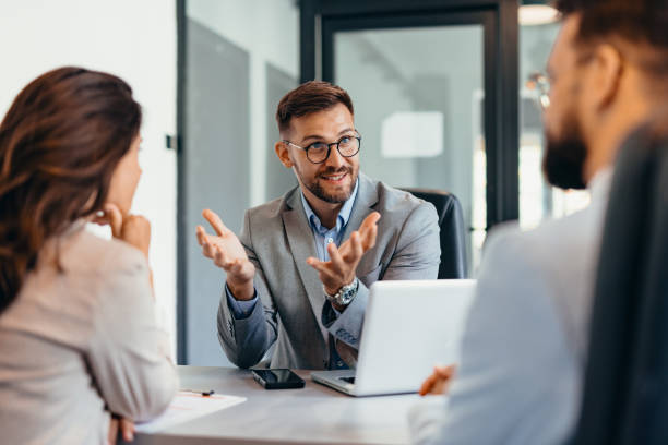 istock Group of business persons talking in the office 2169199382