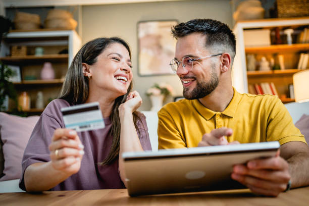 istock Young couple using tablet for online shopping 2169199413