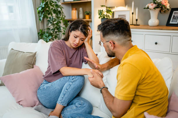 istock Caring husband holding his wife hand 2169199480