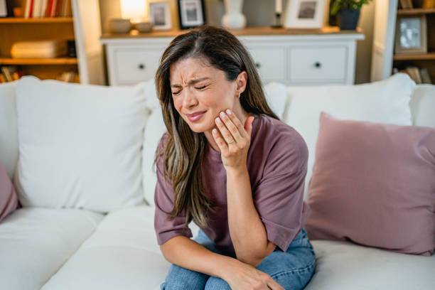 istock Young woman suffering from toothache 2169199821