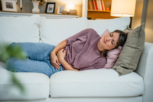 istock Woman suffering from stomach pain 2169199954