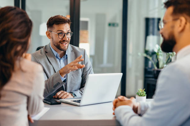 istock Group of business persons talking in the office 2169200019