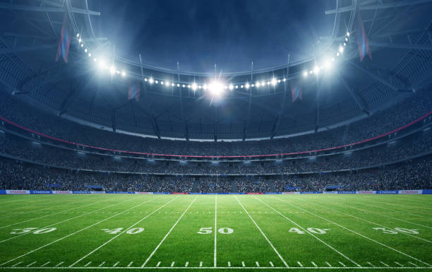 istock American Football Stadium at night with empty field. 2169200225