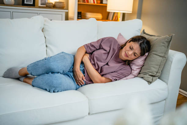 istock Woman suffering from stomach pain 2169200249