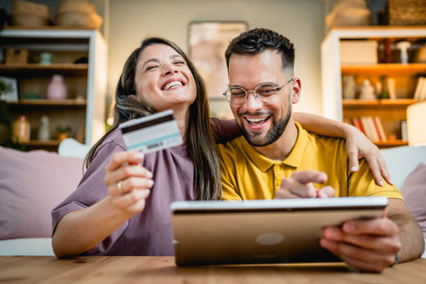 istock Happy couple shopping online 2169200373