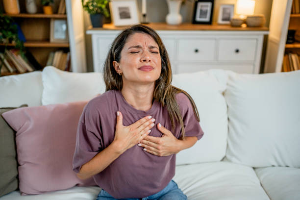 istock Young woman suffering from chest pain 2169200728