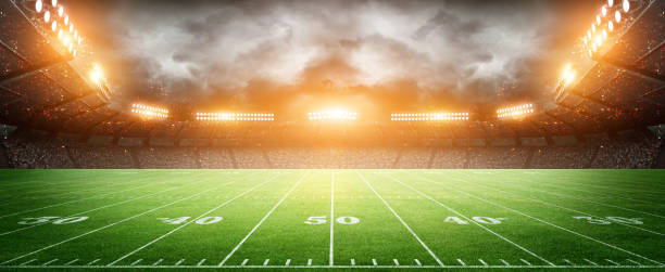istock IIuminated American Football Stadium at night with empty field. 2169201541