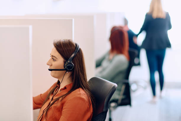 istock Team of Women Providing Customer Support in Call Center Environment. 2169203372