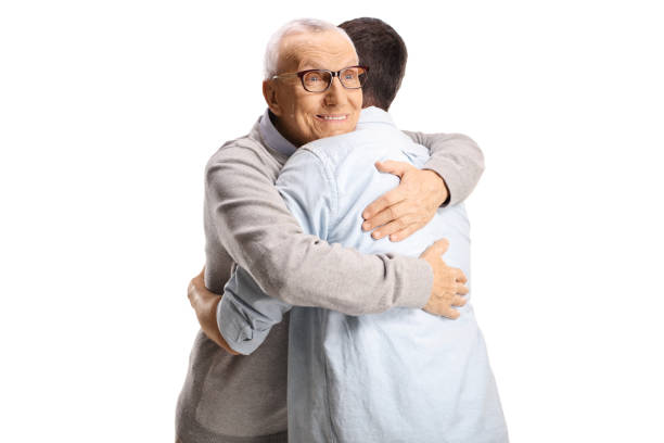istock Elderly man hugging a younger man 2169206891