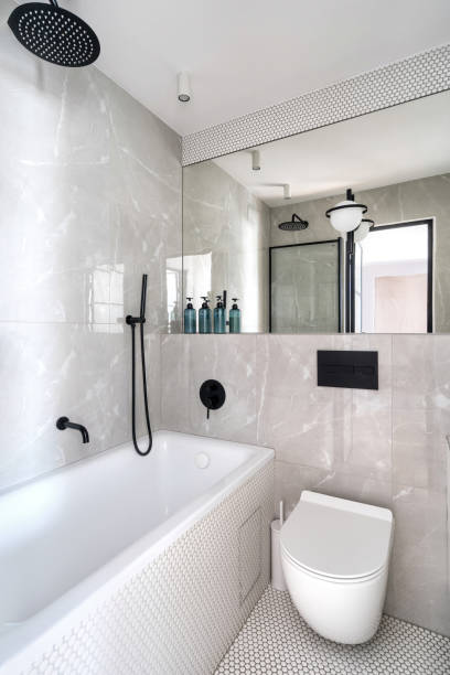 istock Modern bathroom interior with a bathtub and a shower in a minimalist design 2169211036
