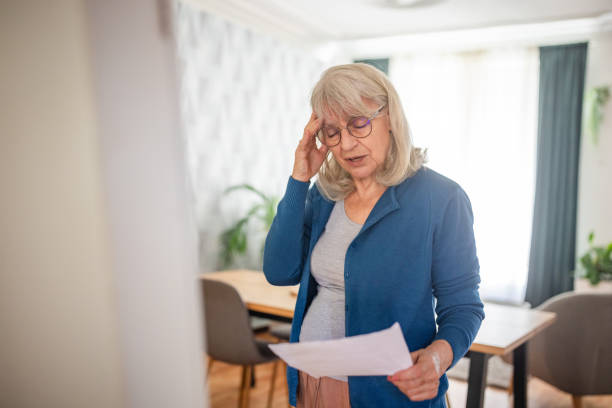 istock Senior Woman Practicing Speech in Front of Mirror at Home 2169212432