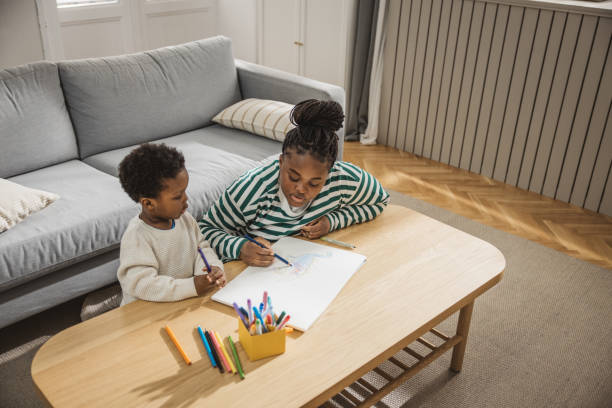 istock Mother and son coloring together 2169213570