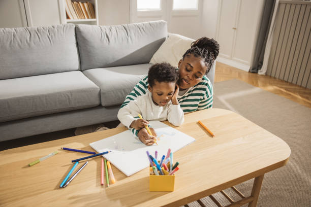 istock Mother and son coloring together 2169213573