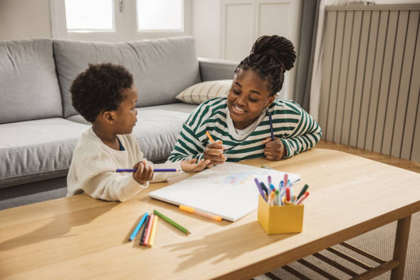 istock Mother and son coloring together 2169213581