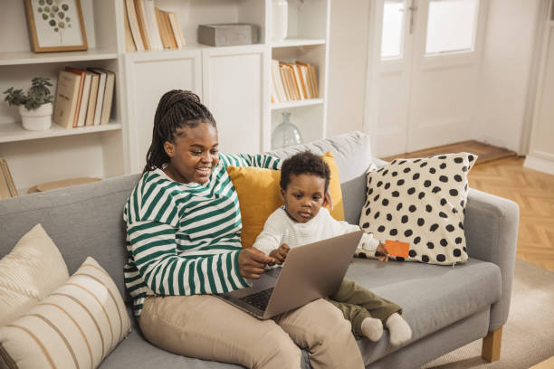 istock Mother and baby boy using laptop 2169213720