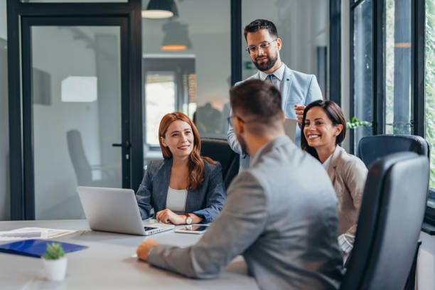 istock Team meeting in modern office with four professional colleagues. 2169214271