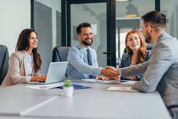 istock Professional business meeting with handshake and discussion. 2169214283