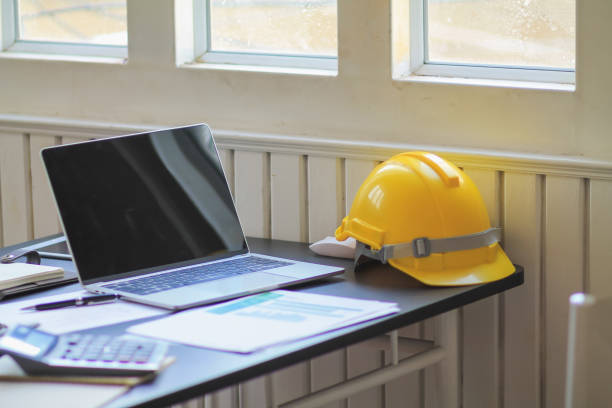 istock Hard yellow plastic helmets or helmets that are placed on the workbench of the engineering team for the safety of the work site. A safety helmet is a basic safety equipment for workers. 2169214511