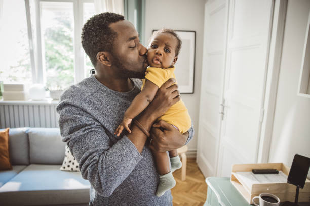 istock Father holding his baby 2169219062