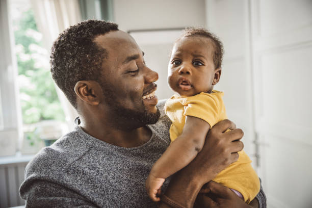 istock Father holding his baby 2169219073