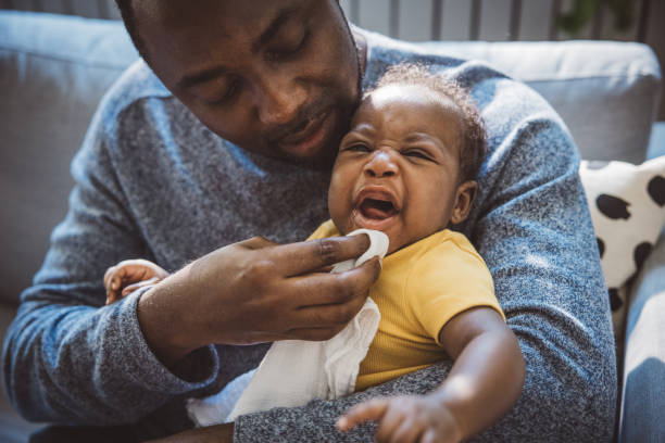 istock Father and baby at home 2169219109