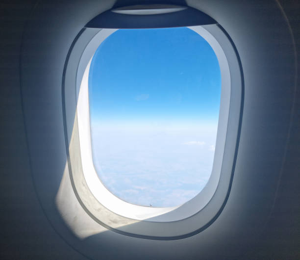 istock Flying above the clouds illuminated by the sun 2169224277
