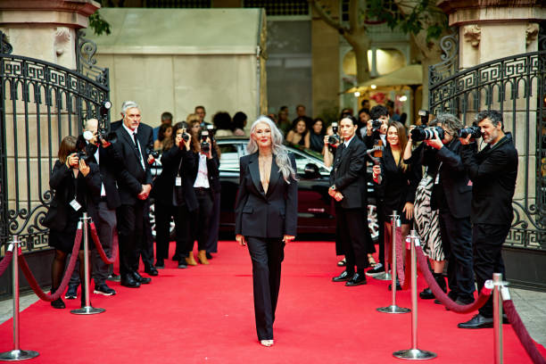 istock Smiling female celebrity walking the red carpet 2169224283