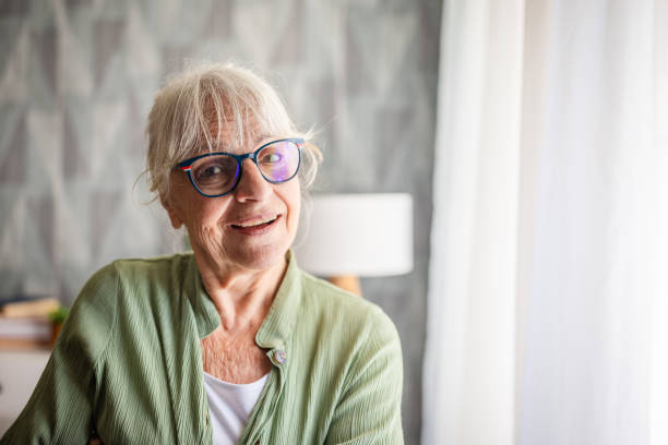 istock Senior woman posing in modern living room setting 2169224789