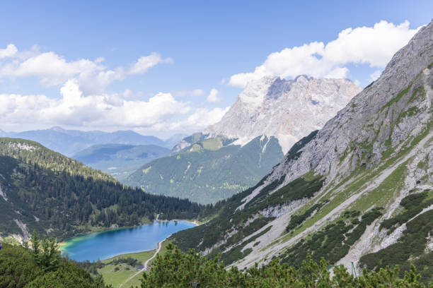 istock Scenic Alpine Lake Surrounded by Mountains 2169227853