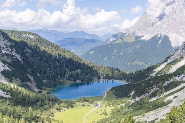 istock Scenic Alpine Lake Surrounded by Mountains 2169227876