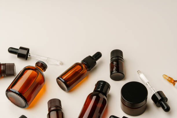 istock Various Amber Glass Containers for Essential Oils and Skin Care Products Displayed on Light Background 2169237111