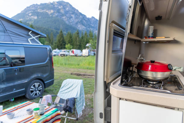 istock Camper Van Kitchen Setup in Scenic Mountain Campground 2169237396