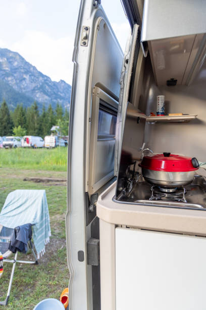 istock Camper Van Kitchen Setup in Scenic Mountain Campground 2169238058