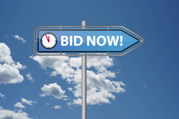 istock Auction eventdirectional sign for bidding, featuring a clock, perfect for auction ads and promotions 2169239835