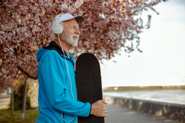 istock Smiling Senior Bearded Male Skateboarder 2169245684