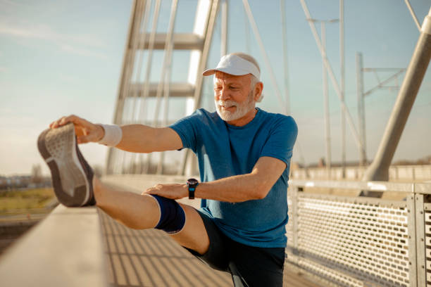 istock Senior Man in Sportswear Doing Stretching Before Exercising 2169245755
