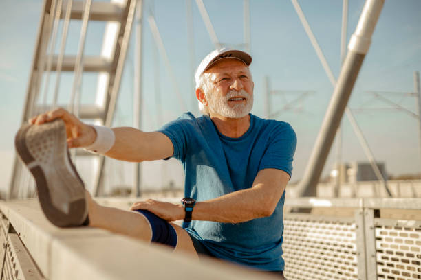istock Senior Man in Sportswear Doing Stretching Before Exercising 2169245814