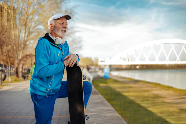 istock Smiling Senior Bearded Male Skateboarder 2169245909