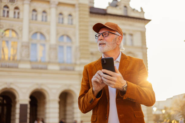 istock Urban Senior Hipster Man Using Smartphone Outdoors 2169245950