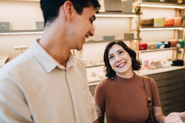 istock Young couple talking on a jewelry store 2169249794