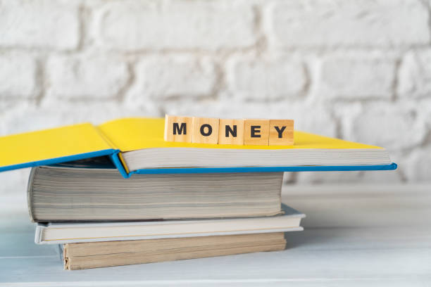 Money, with alphabet blocks