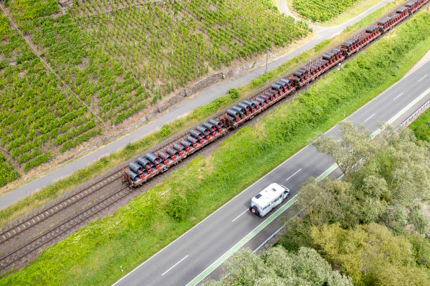 istock Road and railroad track through vineyards 2169251095