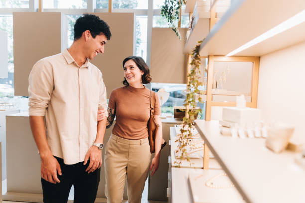 istock Young couple talking on a jewelry store 2169251776