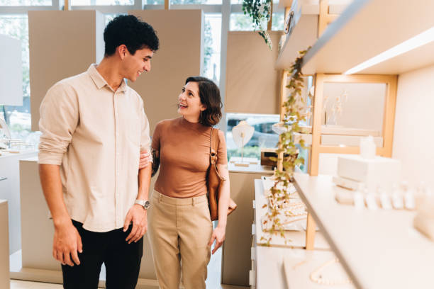 istock Young couple talking on a jewelry store 2169252612