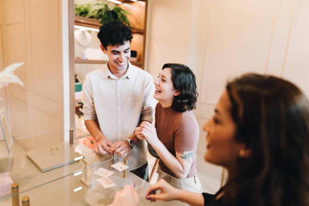 istock Young couple talking on a jewelry store 2169254763