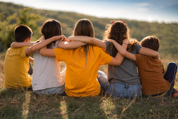 istock Children embracing each other on a mountain 2169255300