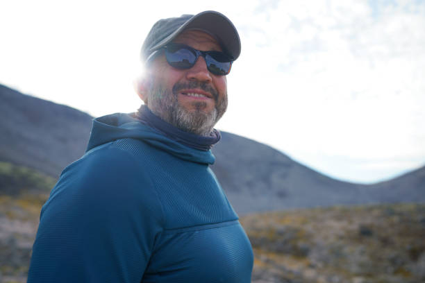 istock Positive mature man in the mountains at sunset 2169264963