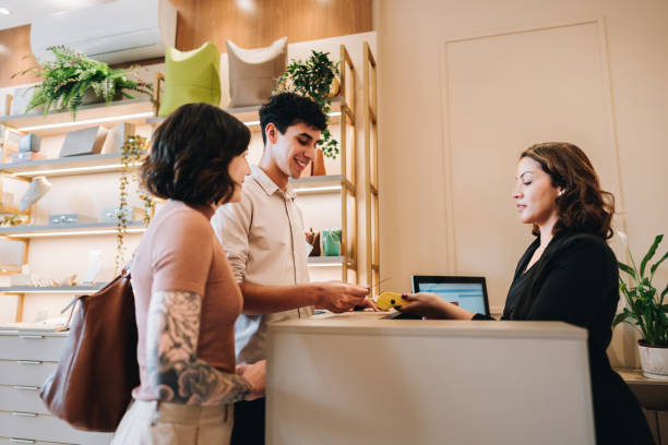 istock Young couple paying on jewelry store 2169266855